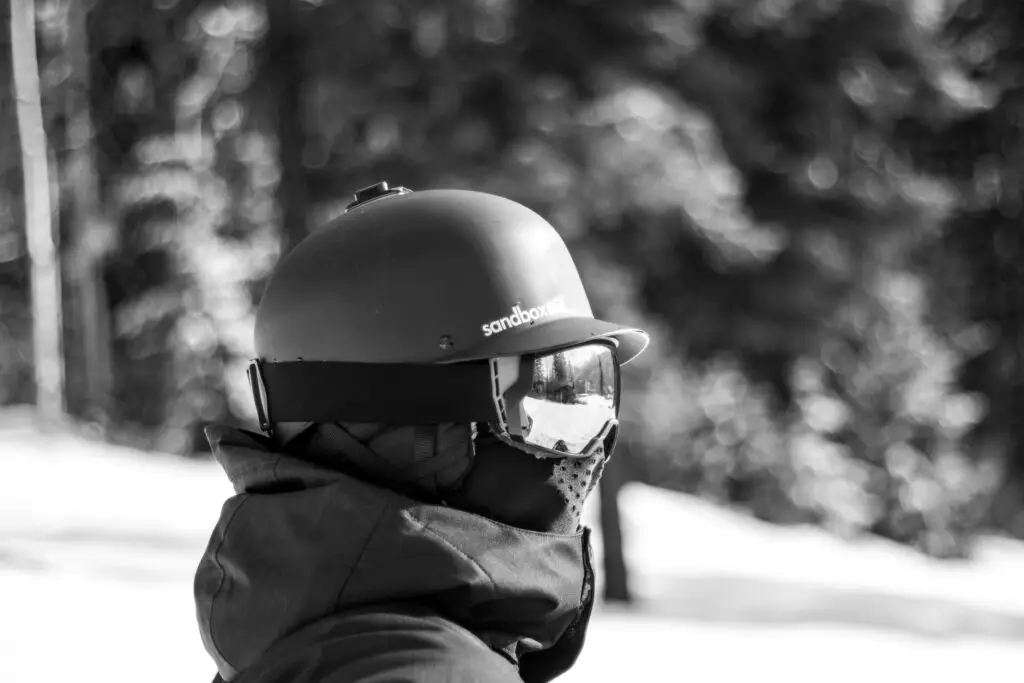 man in ski helmet with bluetooth and headphones