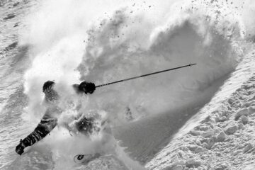 person skiing in powder
